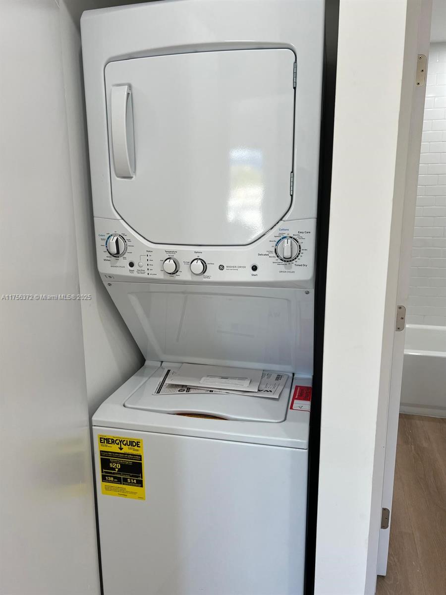 4227 Northwest 5th Street, Unit 8 Miami, FL 33126 - Photo 3 of 12 a utility room with dryer and washer