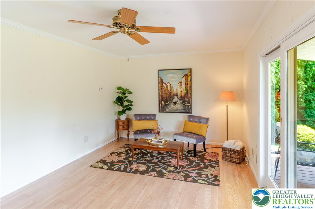 2130 Wisteria Road Lower Macungie Township, PA 18062 - Photo 21 of 48 Family room has a ceiling fan, heated radiant floors, and sliding glass doors that open to the back deck.
