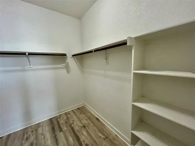 a view of an empty walk in closet