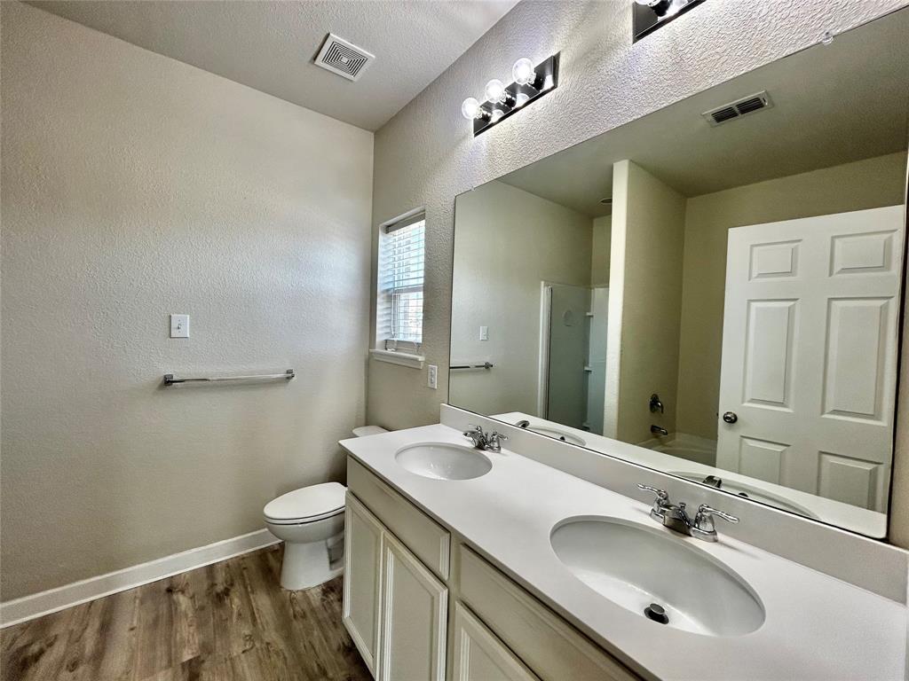 2336 Buelingo Lane Fort Worth, TX 76131 - Photo 12 of 27 a bathroom with a sink and a mirror