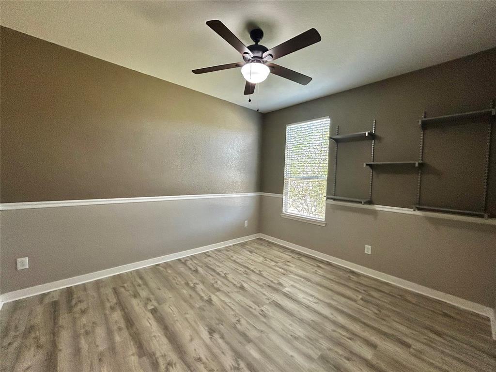 2336 Buelingo Lane Fort Worth, TX 76131 - Photo 16 of 27 wooden floor in an empty room with a window