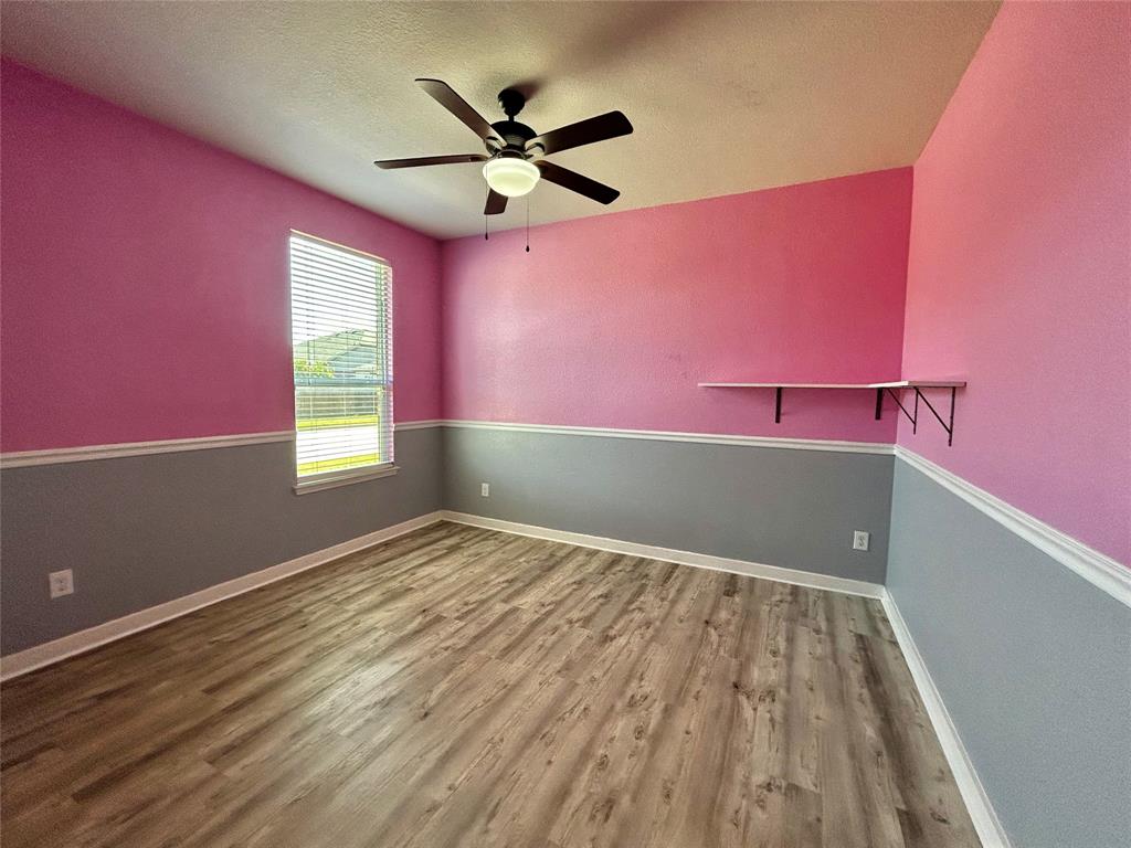 2336 Buelingo Lane Fort Worth, TX 76131 - Photo 18 of 27 a view of a livingroom with a ceiling fan and window