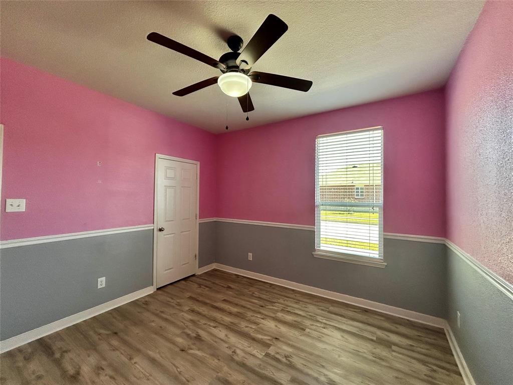 2336 Buelingo Lane Fort Worth, TX 76131 - Photo 19 of 27 a view of empty room with window and ceiling fan