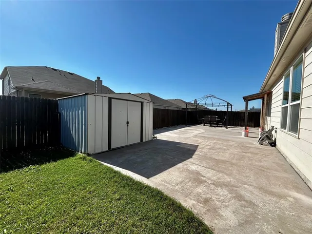 a view of backyard with garage