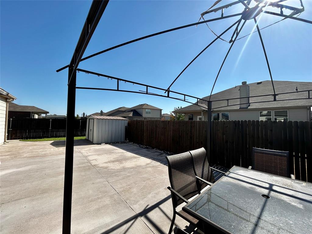 2336 Buelingo Lane Fort Worth, TX 76131 - Photo 23 of 27 a patio with table and chairs