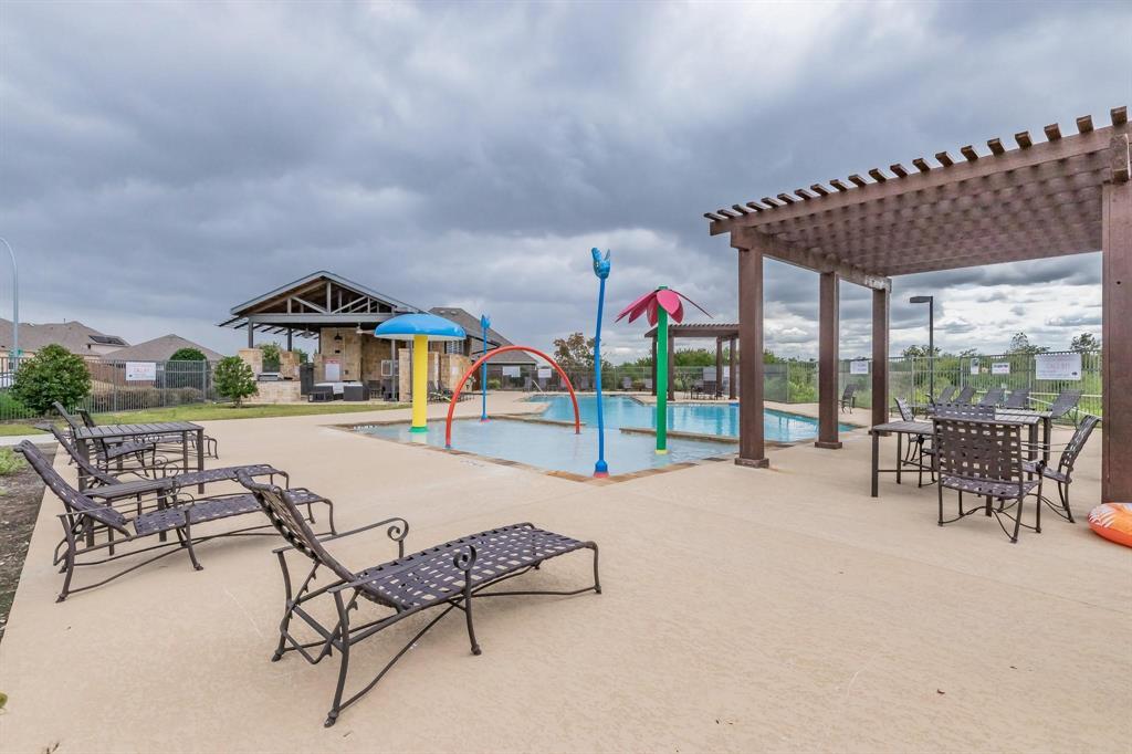 2336 Buelingo Lane Fort Worth, TX 76131 - Photo 24 of 27 a roof deck with table and chairs and potted plants