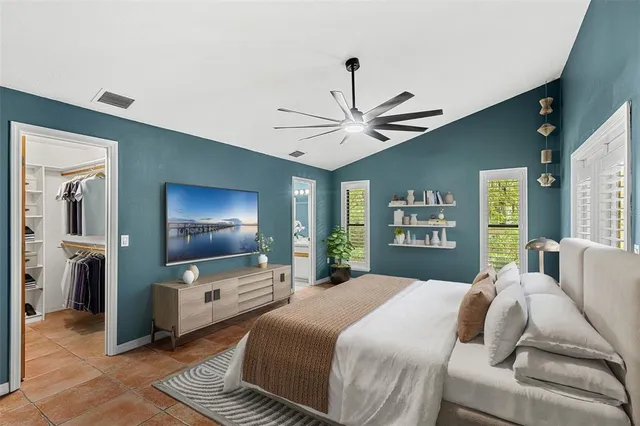 a living room with a fireplace and a large window