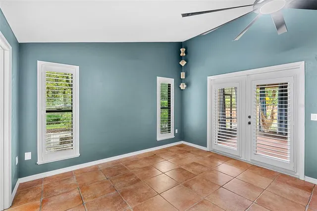 a bathroom with a granite countertop toilet sink and mirror
