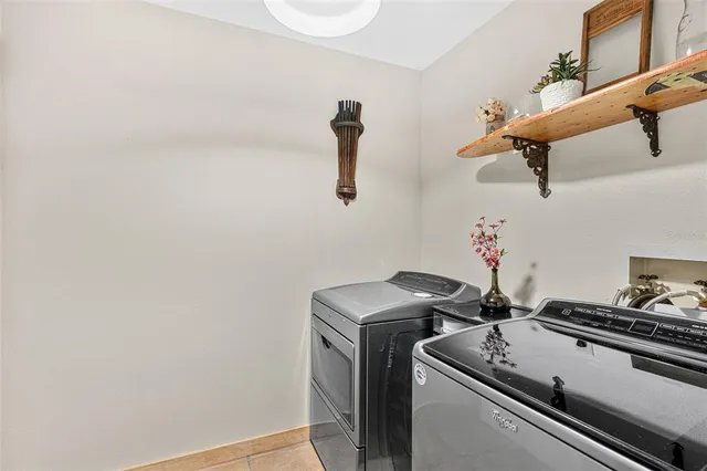 an aerial view of a house with a yard and garden