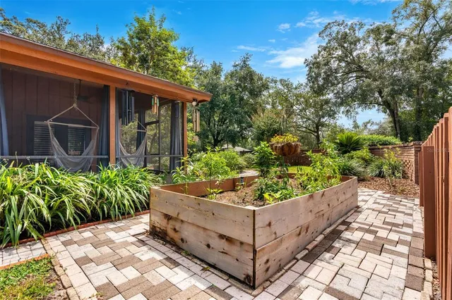 an aerial view of a house with a garden