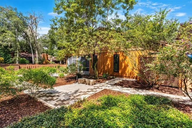 a view of a swimming pool with a yard