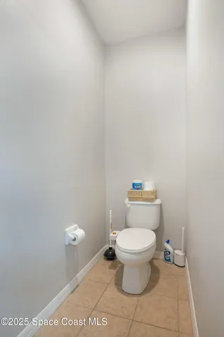 a white toilet sitting next to a white toilet