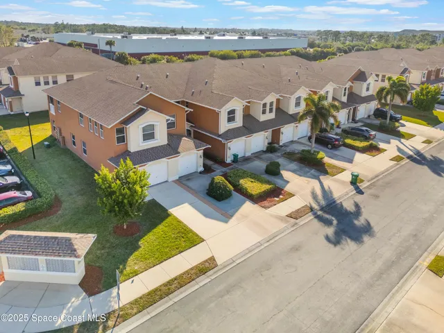 an aerial view of a house with outdoor space and lake view