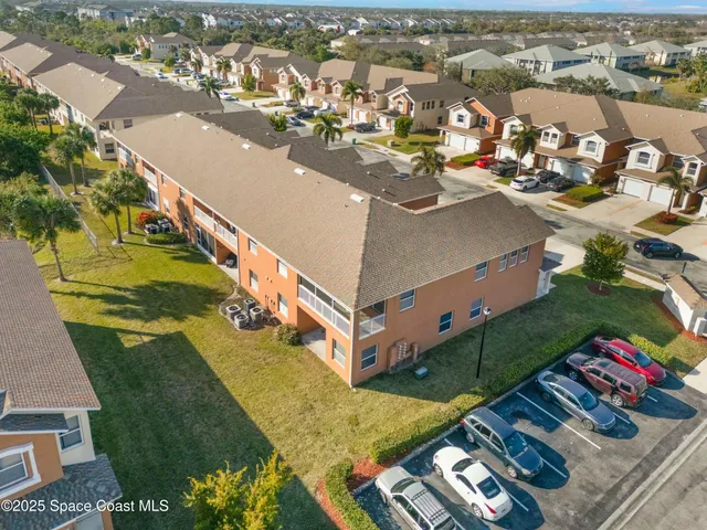 an aerial view of a house with a ocean view