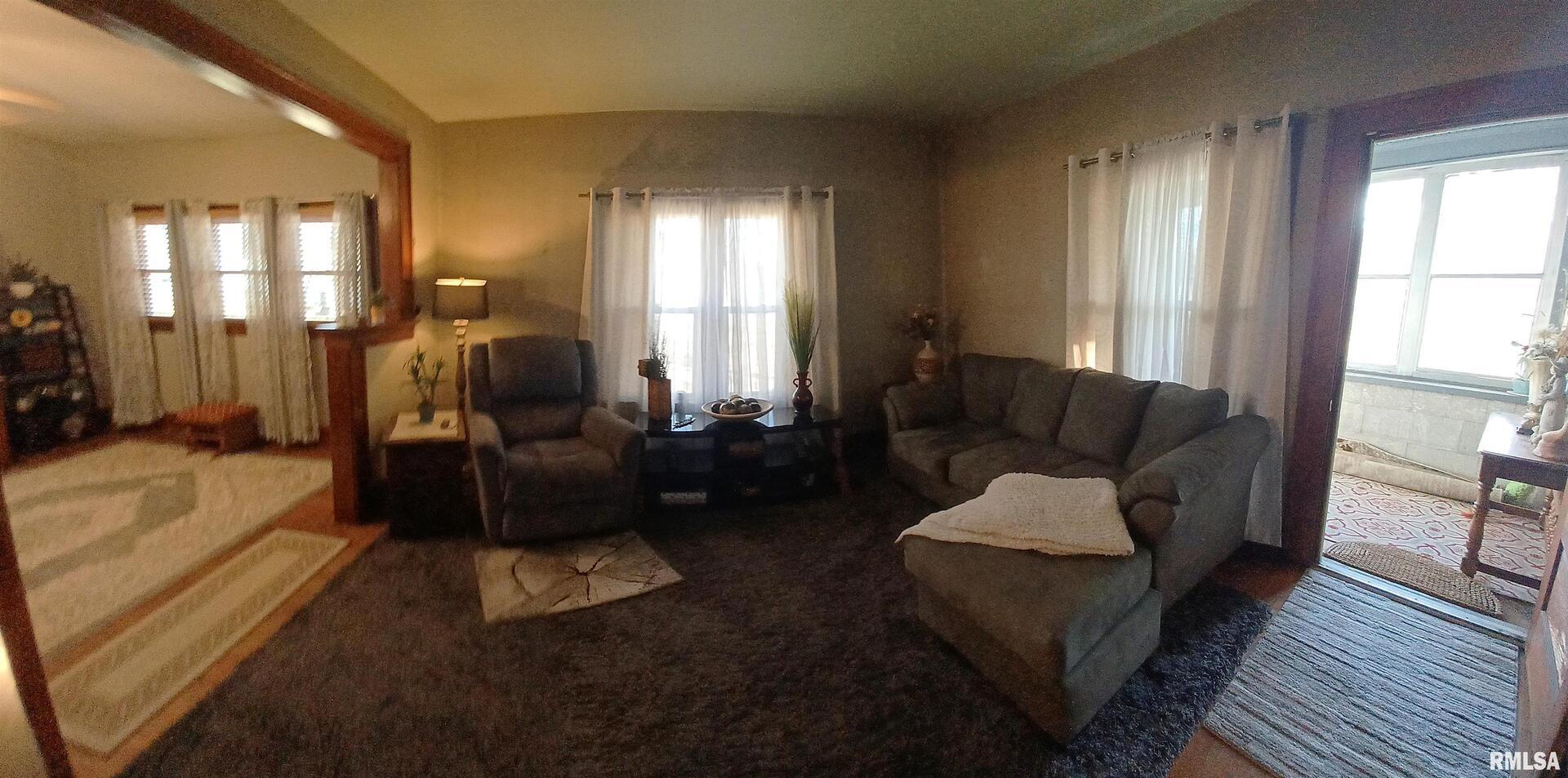 1208 Pine Street Kewanee, IL 61443 - Photo 14 of 36 a living room with furniture and a fireplace