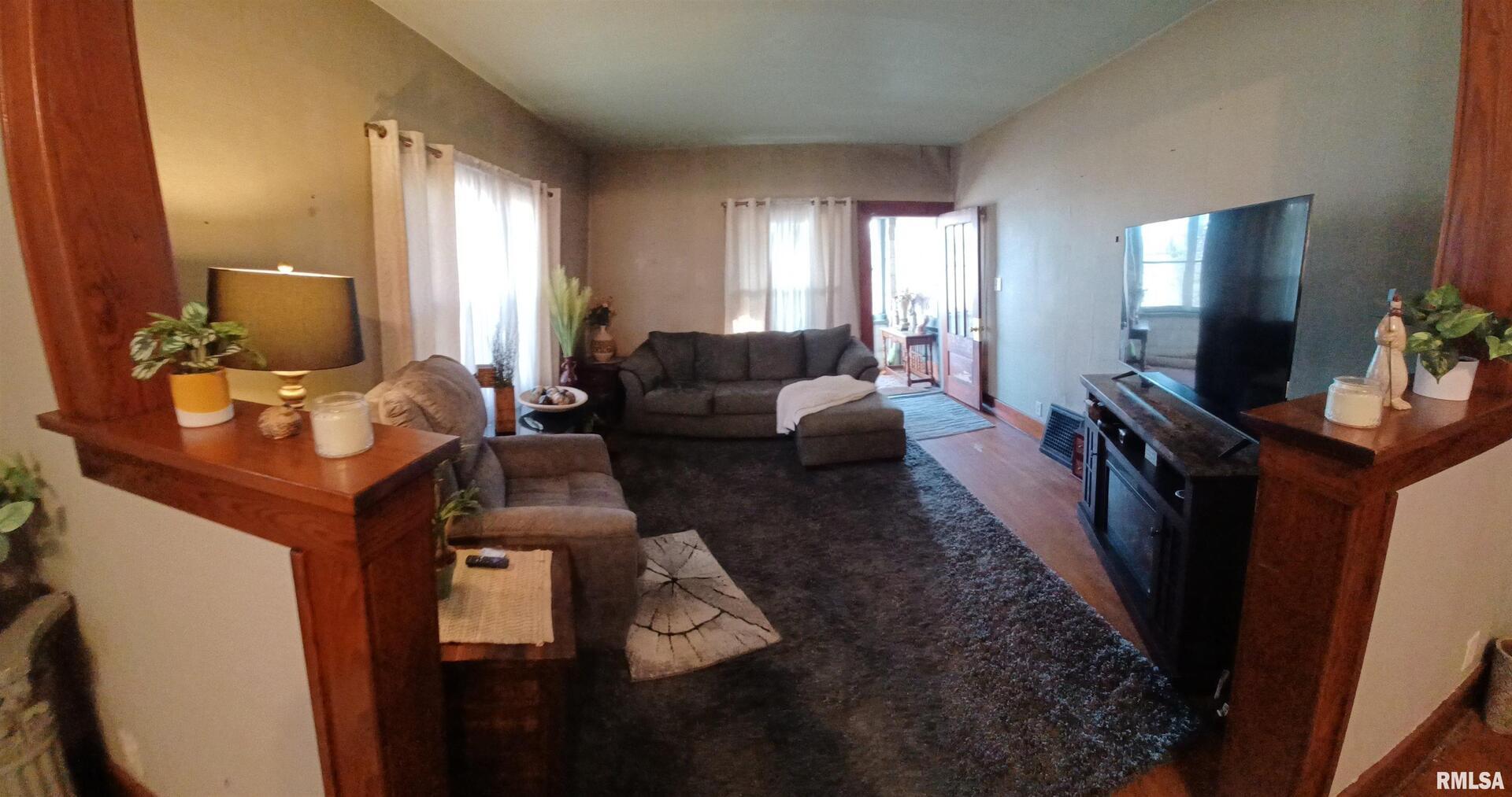 1208 Pine Street Kewanee, IL 61443 - Photo 16 of 36 a living room with furniture and a flat screen tv