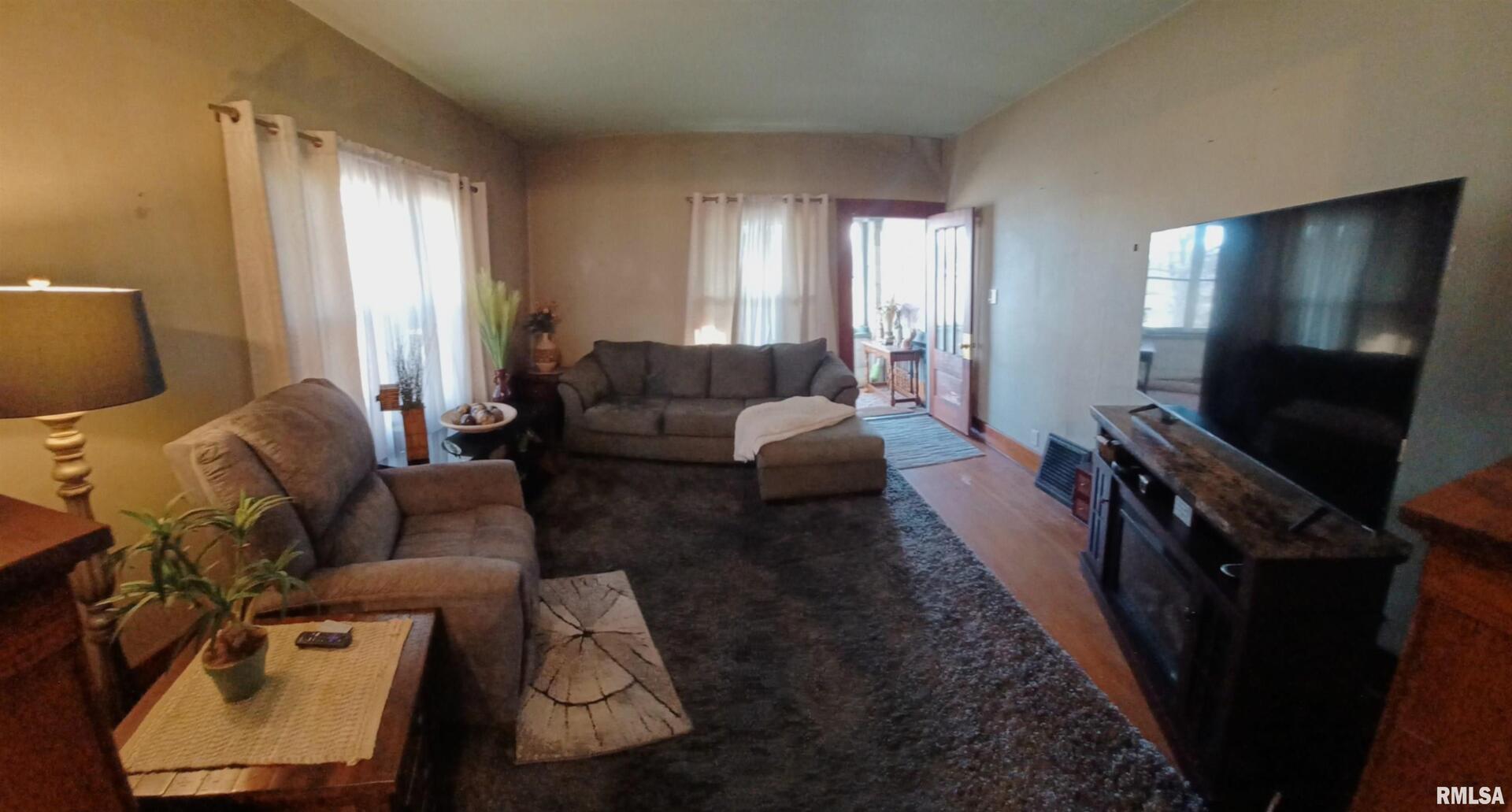 1208 Pine Street Kewanee, IL 61443 - Photo 19 of 36 a living room with furniture and a flat screen tv