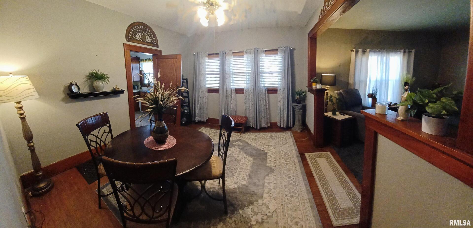 1208 Pine Street Kewanee, IL 61443 - Photo 20 of 36 a view of a dining room with furniture and wooden floor