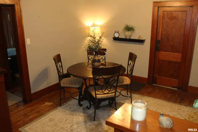 a dining room with furniture and window