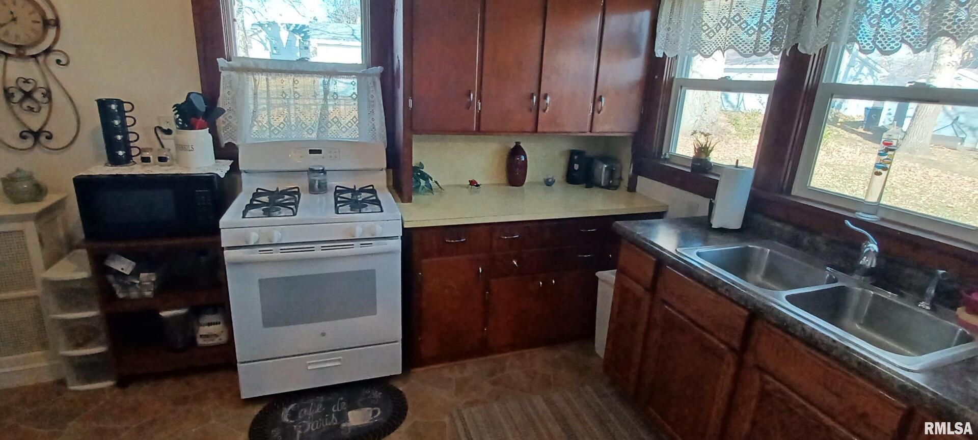 1208 Pine Street Kewanee, IL 61443 - Photo 27 of 36 a kitchen with a sink stove and cabinets