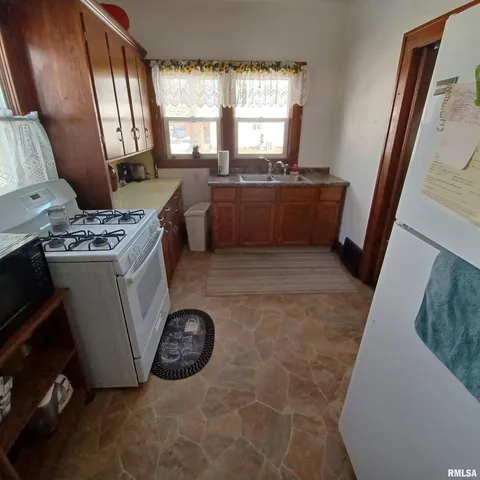 a view of kitchen with window and furniture