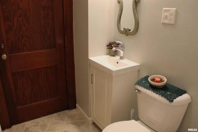 a bathroom with a toilet and a sink