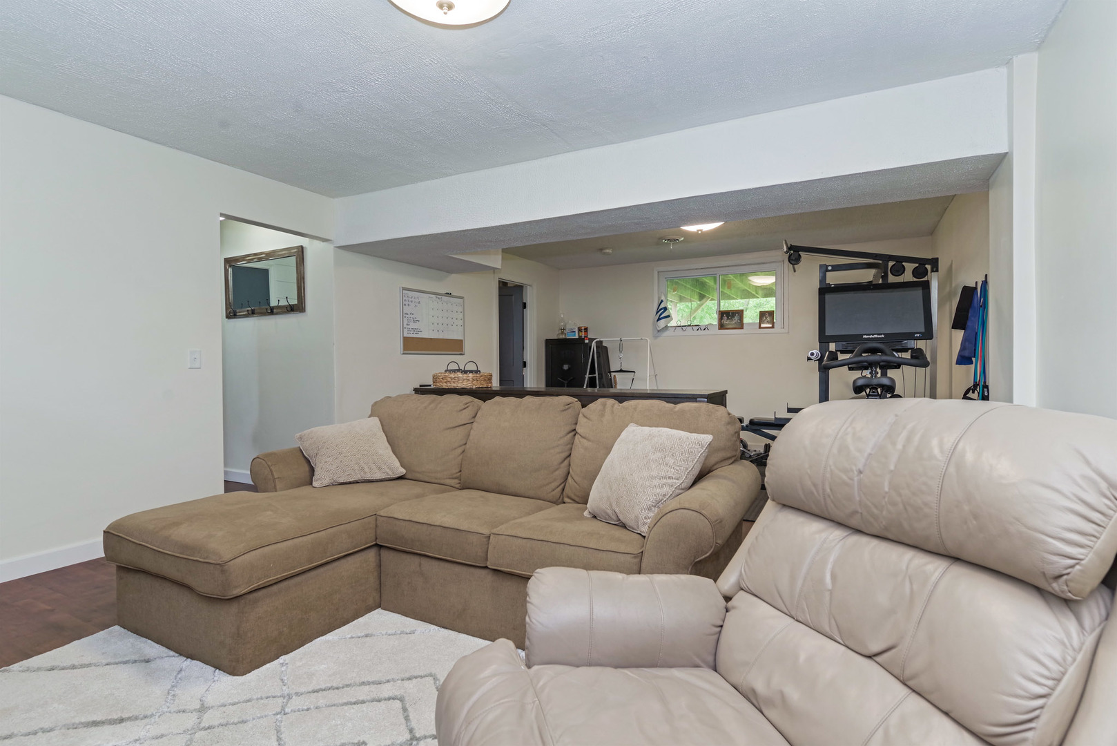 25476 Valley View Road Tremont, IL 61568 - Photo 24 of 45 a living room with furniture white walls and a lamp
