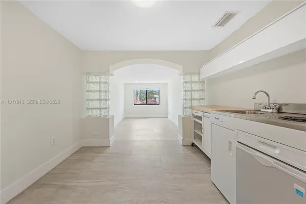 a view of a kitchen with a sink