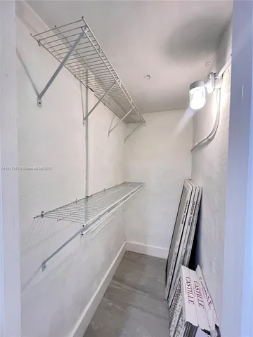 a view of a room with racks on the wall