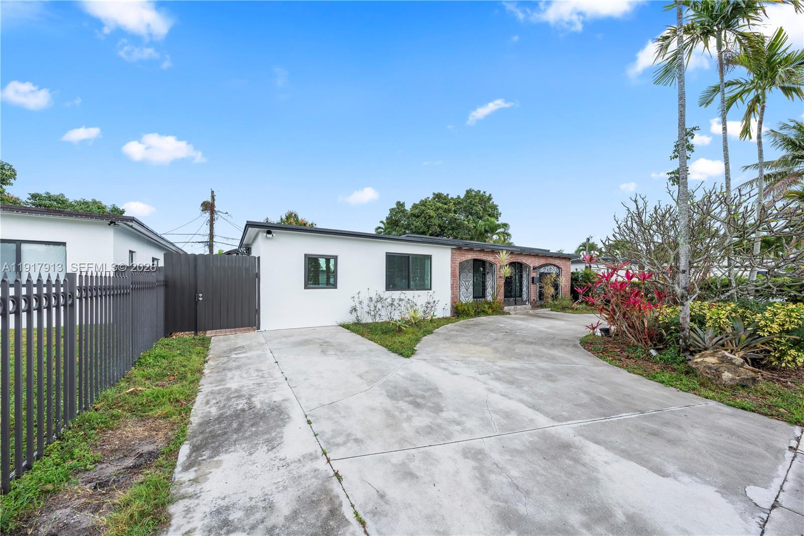 161 Southwest 52nd Court, Unit 161 Miami, FL 33134 - Photo 4 of 22 a view of a house with a yard and potted plants