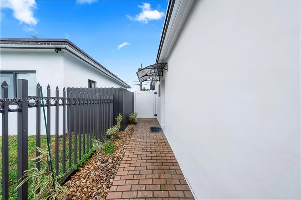 a view of a pathway of a house with wooden floor