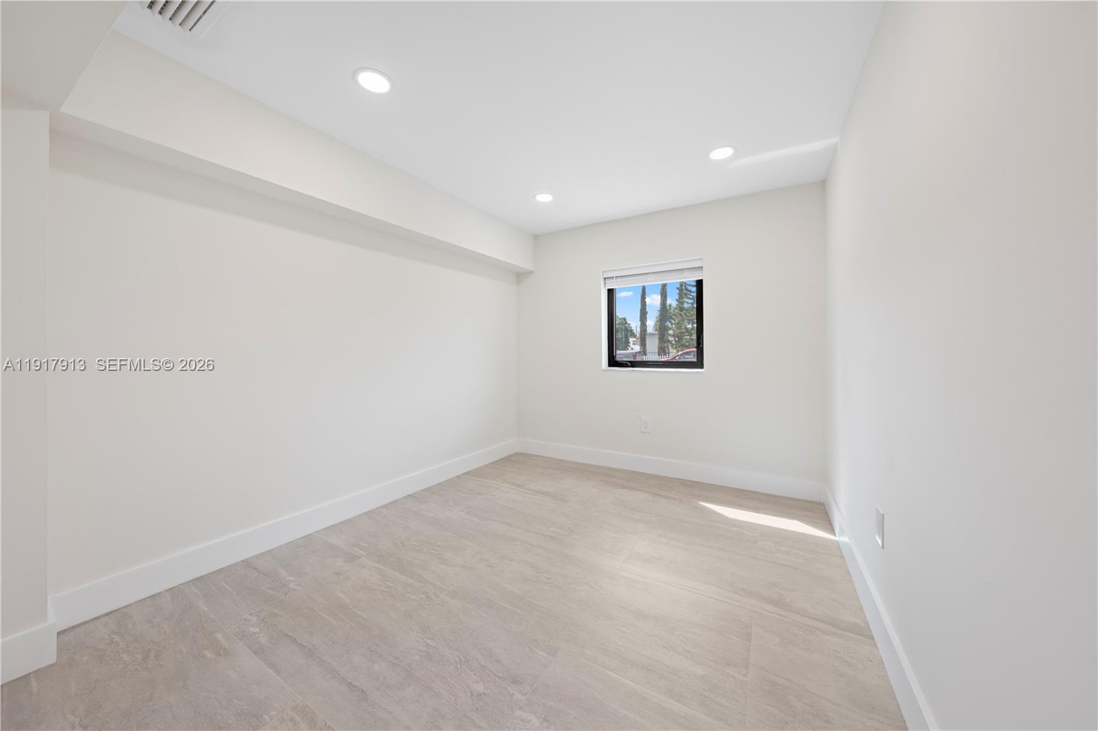 161 Southwest 52nd Court, Unit 161 Miami, FL 33134 - Photo 7 of 22 an empty room with windows