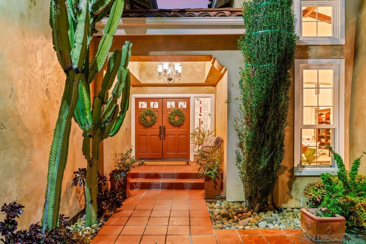 10235 Rue Chamberry San Diego, CA 92131 - Photo 12 of 72 a front view of a house with a yard