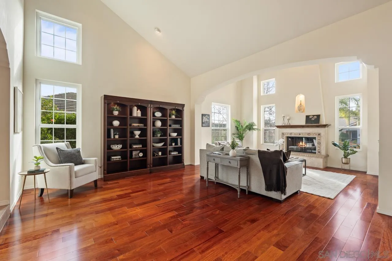 10235 Rue Chamberry San Diego, CA 92131 - Photo 17 of 72 a living room with furniture and a large window