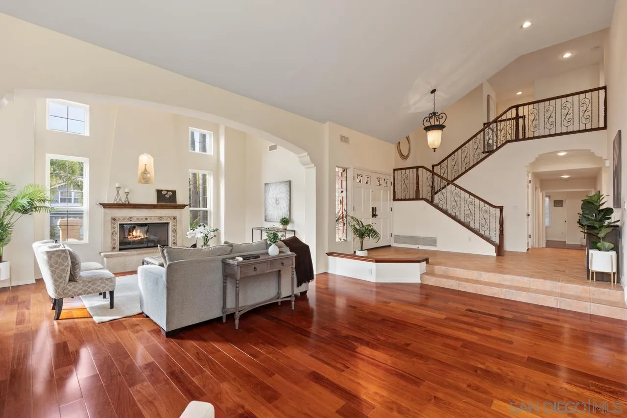 10235 Rue Chamberry San Diego, CA 92131 - Photo 18 of 72 a living room with furniture and a wooden floor
