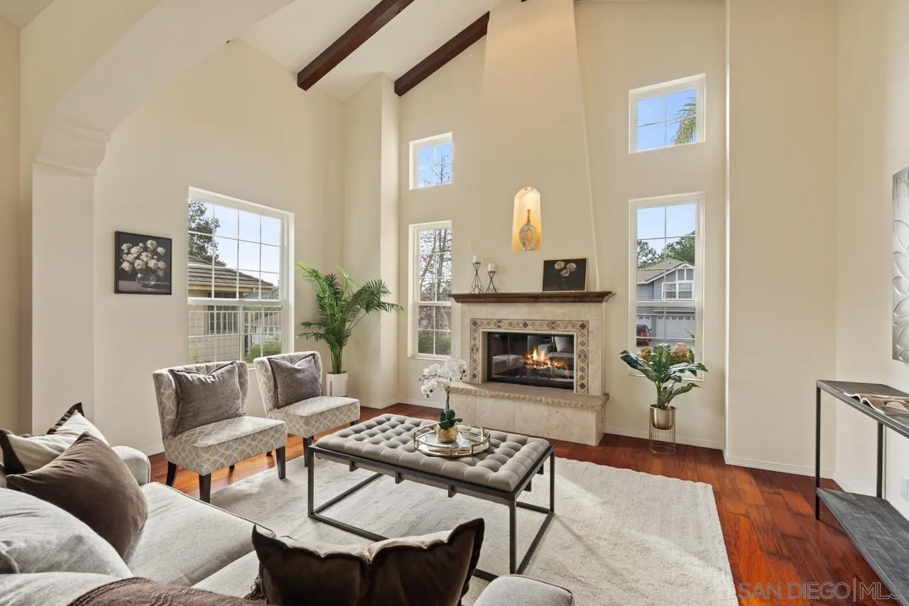 10235 Rue Chamberry San Diego, CA 92131 - Photo 19 of 72 a living room with furniture and a fireplace