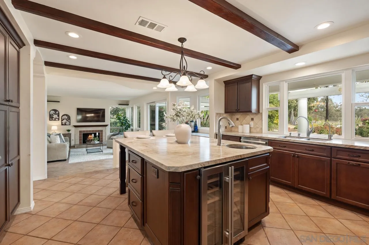 10235 Rue Chamberry San Diego, CA 92131 - Photo 25 of 72 a kitchen with a sink and cabinets