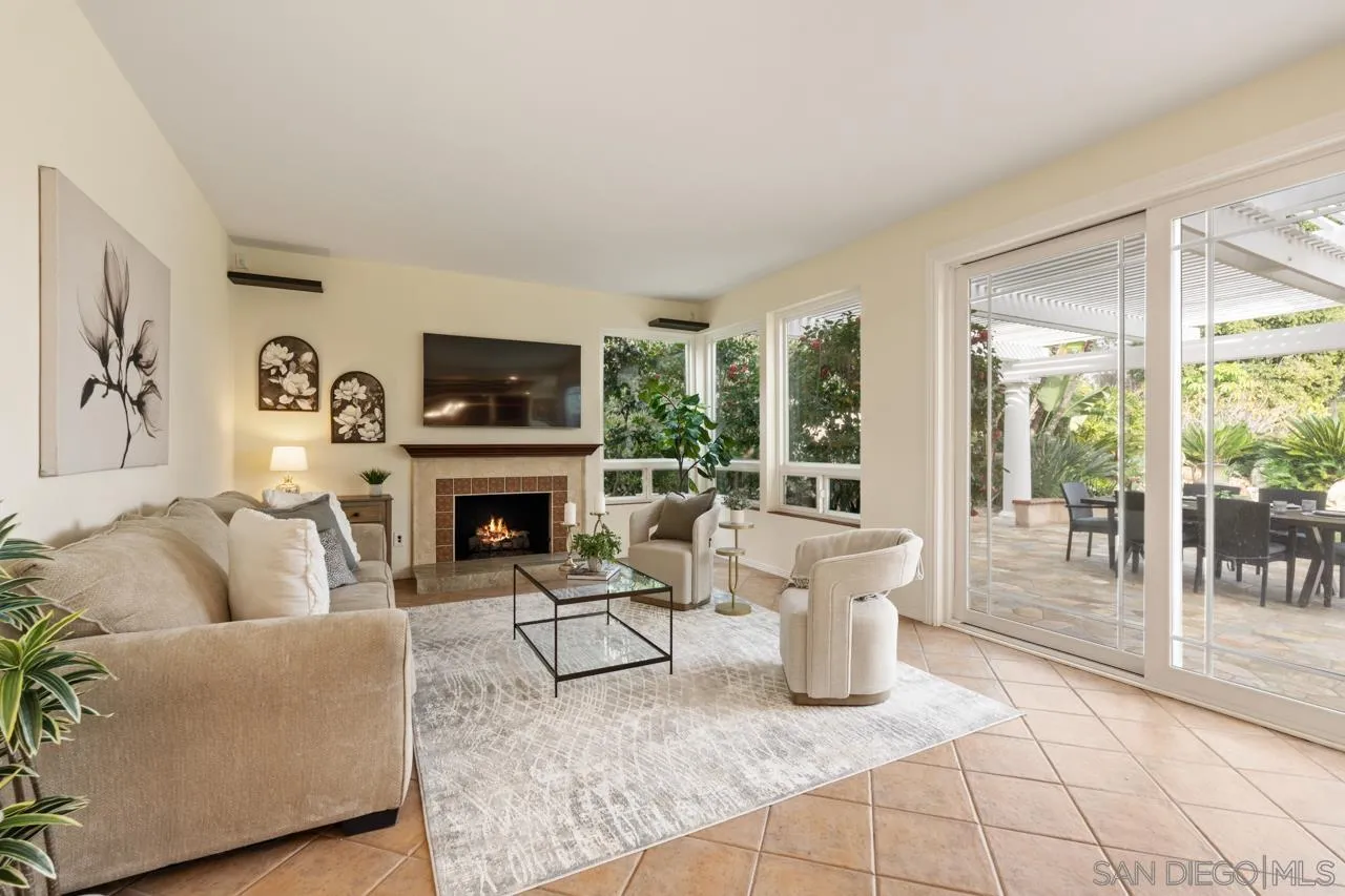 10235 Rue Chamberry San Diego, CA 92131 - Photo 28 of 72 a living room with furniture and a fireplace