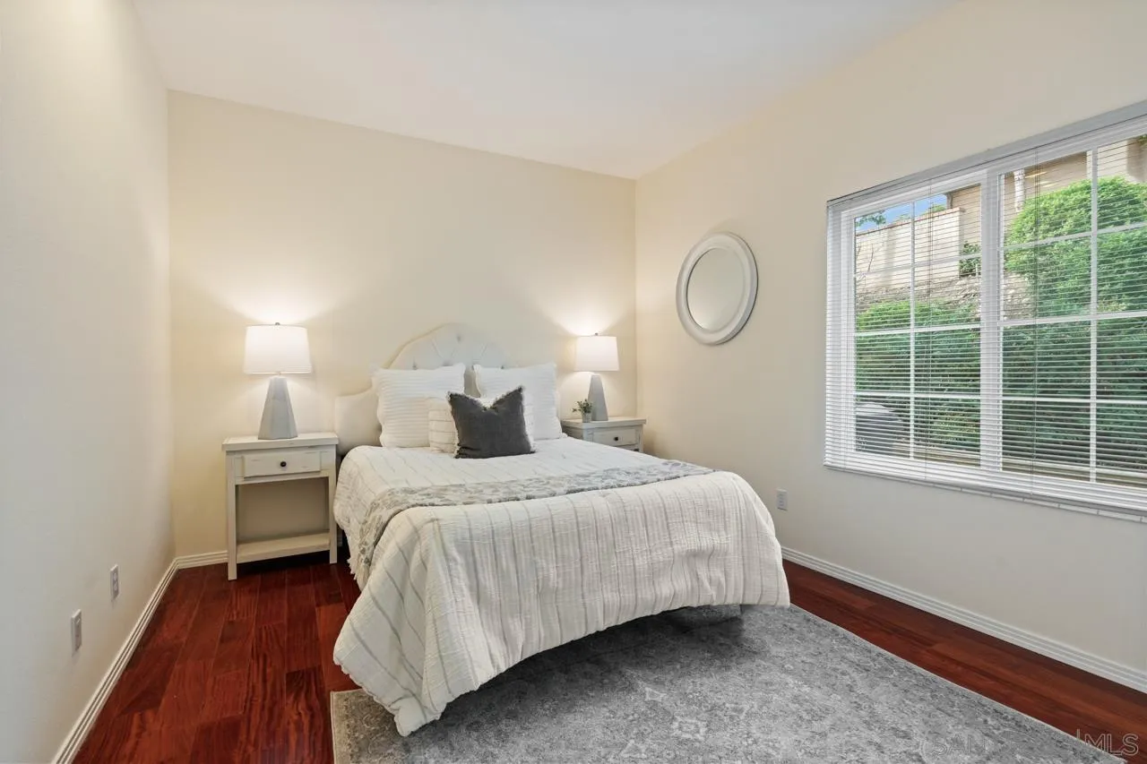 10235 Rue Chamberry San Diego, CA 92131 - Photo 29 of 72 a bedroom with a bed and window