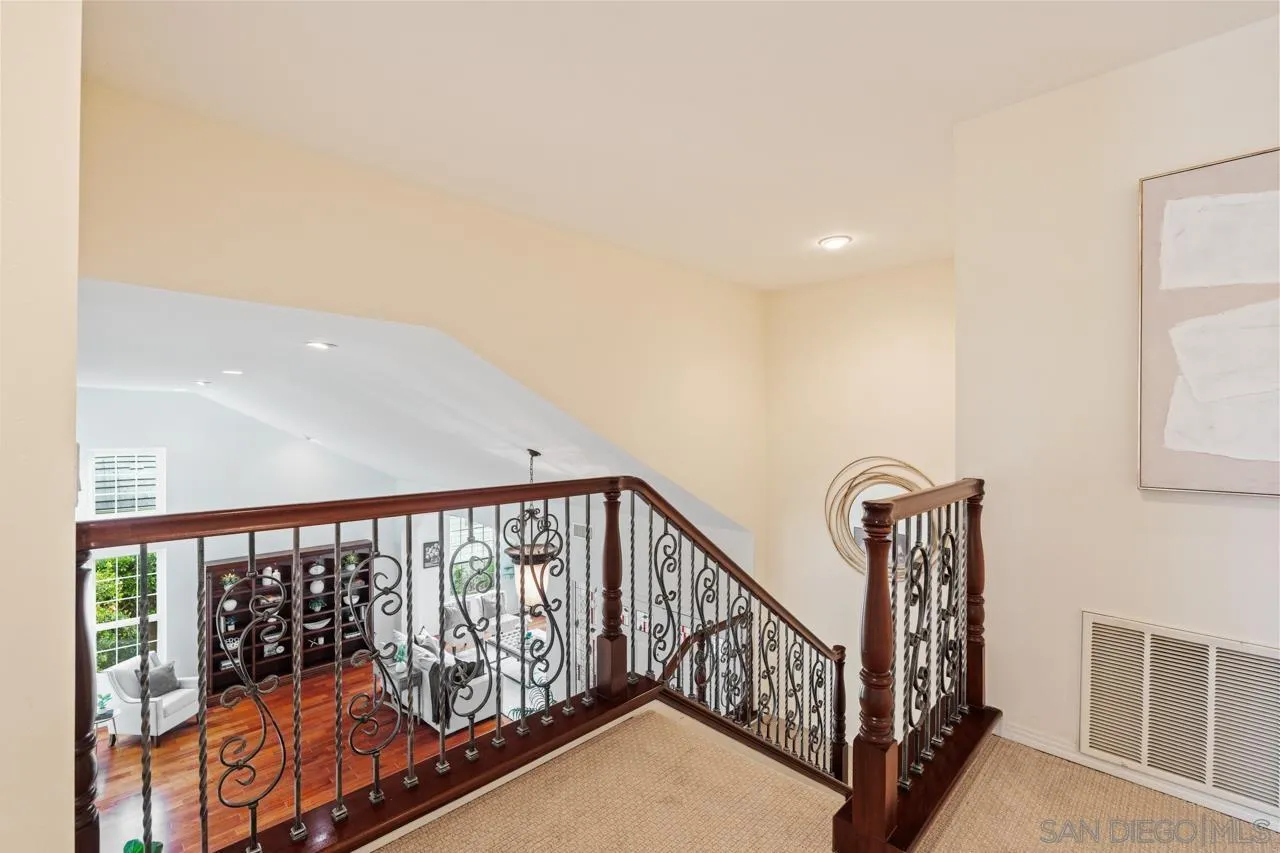 10235 Rue Chamberry San Diego, CA 92131 - Photo 32 of 72 a view of staircase with railing and a rug
