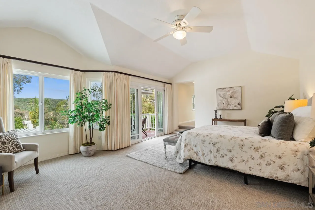 10235 Rue Chamberry San Diego, CA 92131 - Photo 33 of 72 a bedroom with a large bed and a window