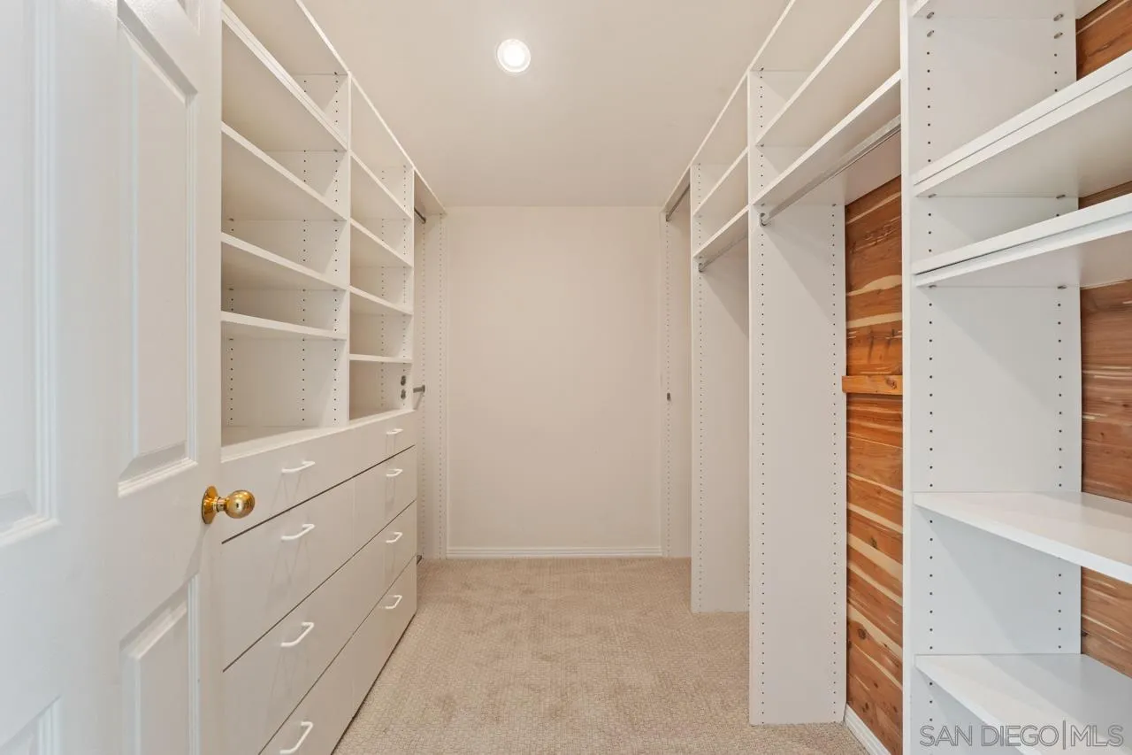 10235 Rue Chamberry San Diego, CA 92131 - Photo 37 of 72 a view of closet with empty racks