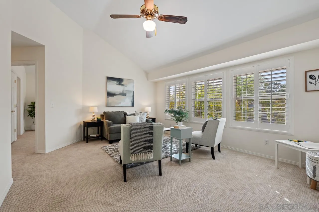 10235 Rue Chamberry San Diego, CA 92131 - Photo 46 of 72 a living room with furniture and a large window