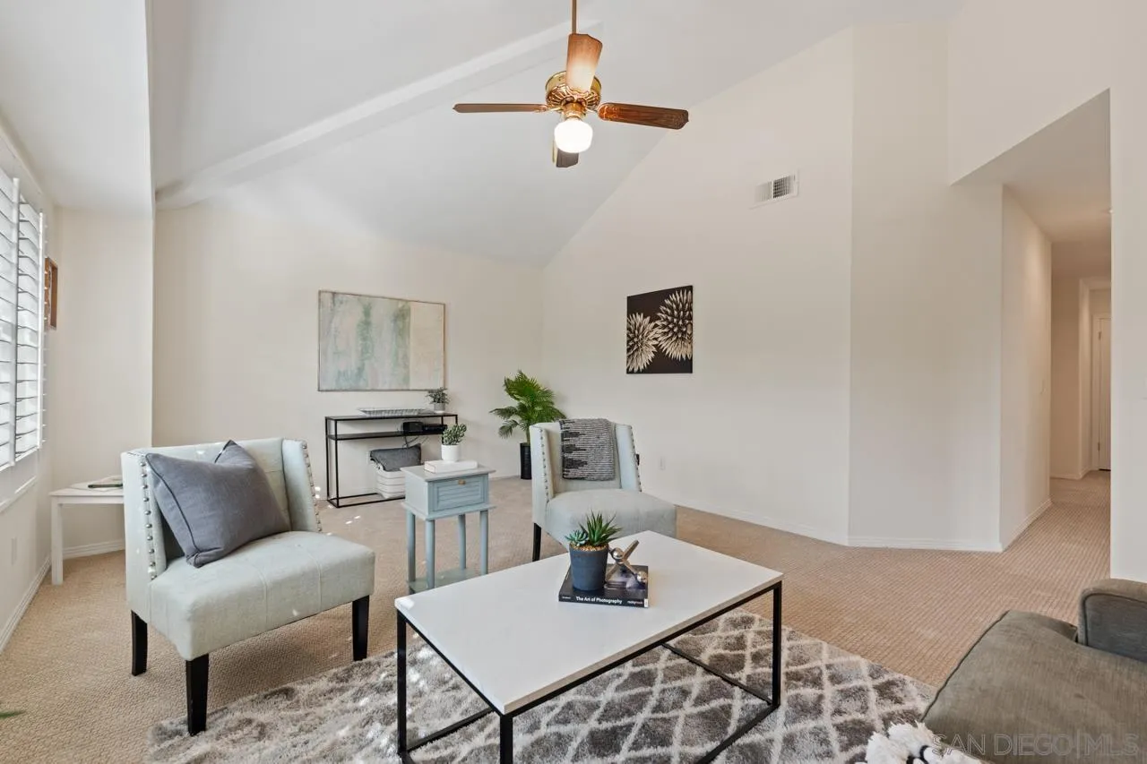 10235 Rue Chamberry San Diego, CA 92131 - Photo 47 of 72 a living room with furniture and a wooden floor