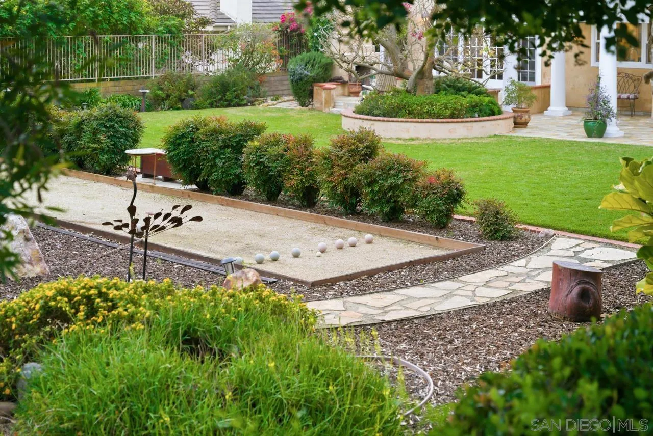 10235 Rue Chamberry San Diego, CA 92131 - Photo 54 of 72 a view of a garden with a bench in the garden