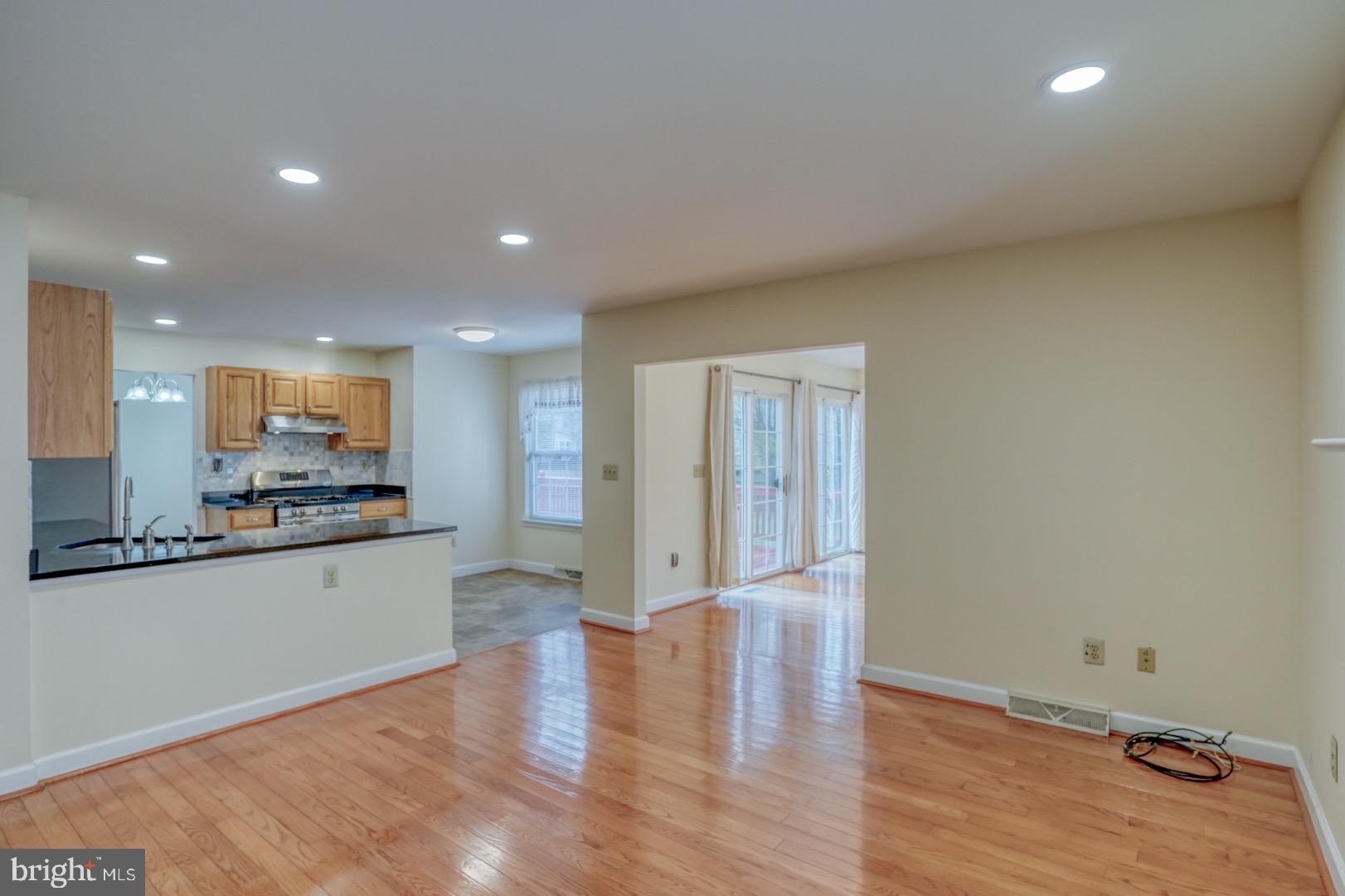 22 Arbor Drive Dover, DE 19904 - Photo 22 of 52 a view of a kitchen with kitchen island wooden floor center island and stainless steel appliances