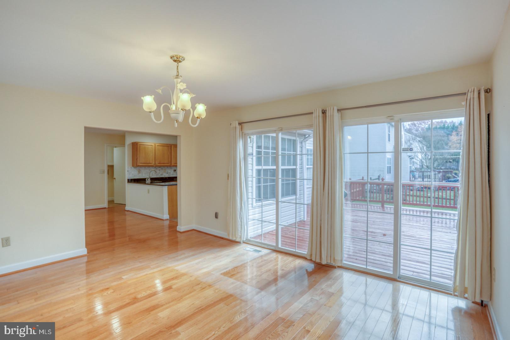 22 Arbor Drive Dover, DE 19904 - Photo 27 of 52 wooden floor in an empty room with a window