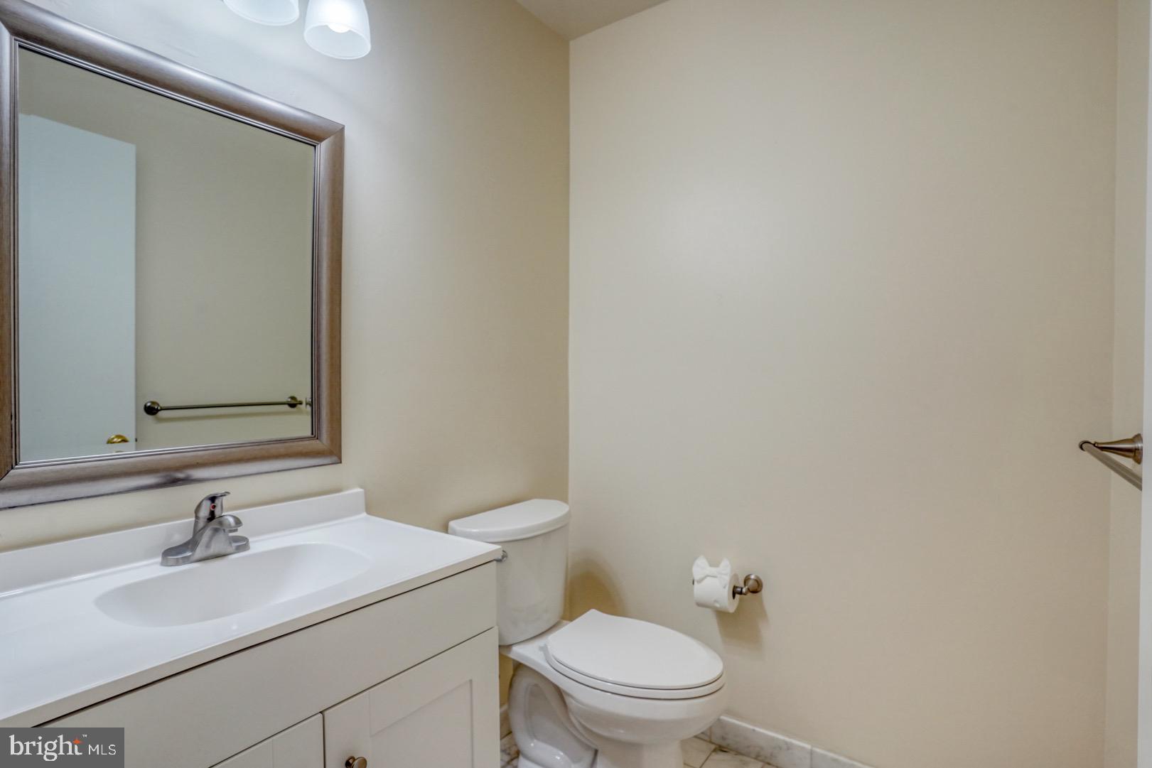 22 Arbor Drive Dover, DE 19904 - Photo 29 of 52 a bathroom with a sink toilet and mirror
