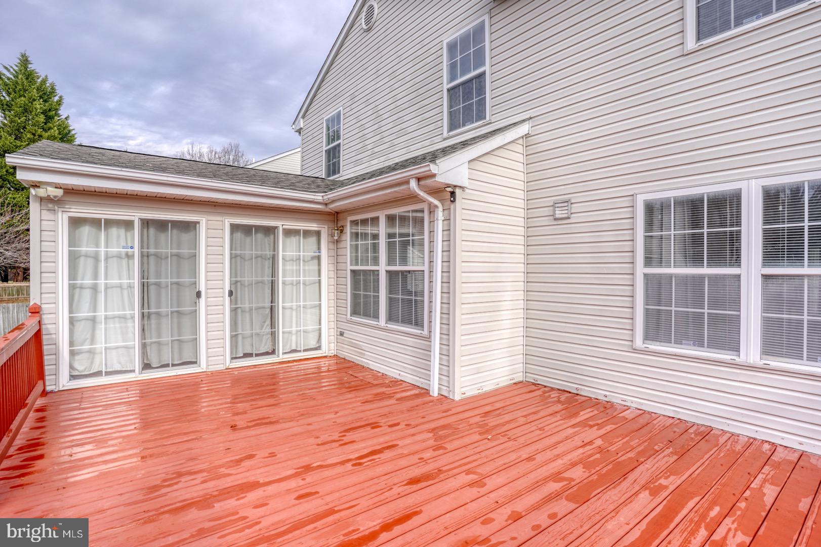 22 Arbor Drive Dover, DE 19904 - Photo 51 of 52 a view of an empty room with wooden floor and a window
