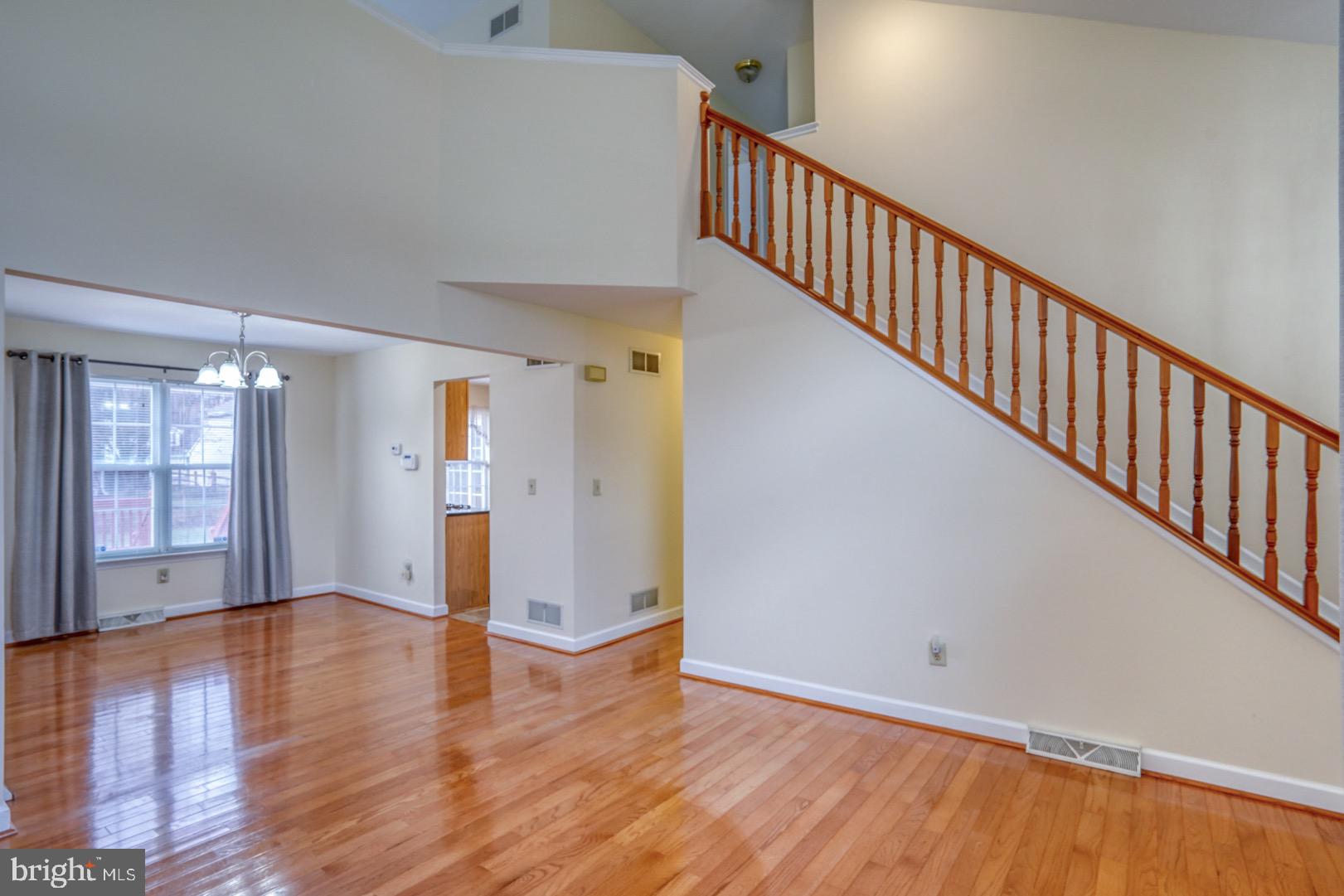 22 Arbor Drive Dover, DE 19904 - Photo 9 of 52 a view of an empty room with wooden floor and windows
